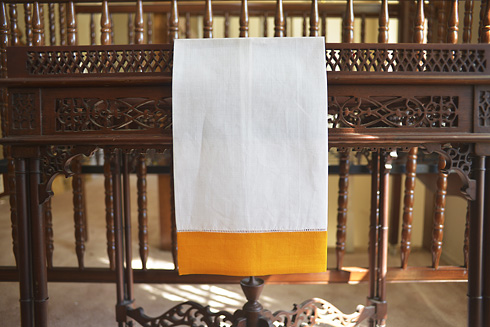 White Hemstitch Guest Towel with Tangelo Color Border. 14x22